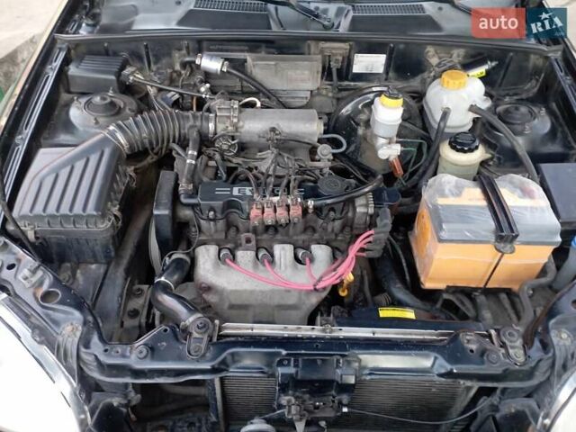 Чорний Деу Ланос, об'ємом двигуна 1.5 л та пробігом 184 тис. км за 3000 $, фото 1 на Automoto.ua