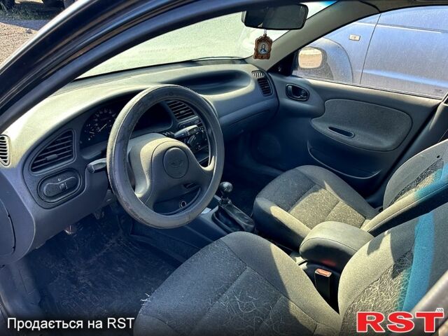 Черный Дэу Ланос, объемом двигателя 1.5 л и пробегом 516 тыс. км за 1770 $, фото 7 на Automoto.ua