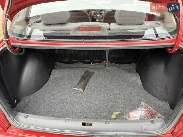 Черный Дэу Ланос, объемом двигателя 1.6 л и пробегом 156 тыс. км за 2400 $, фото 13 на Automoto.ua