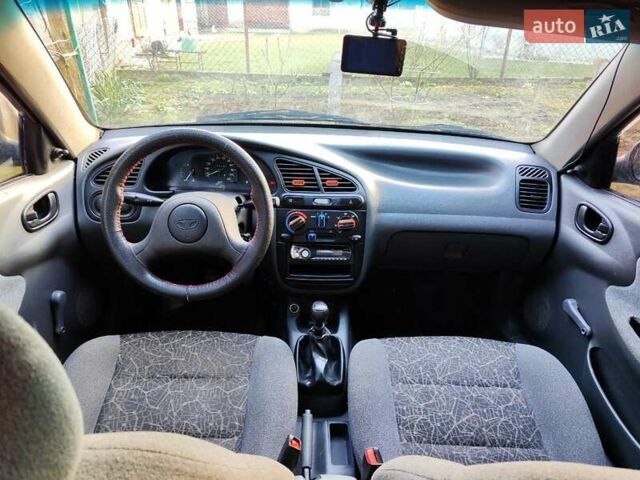 Черный Дэу Ланос, объемом двигателя 1.4 л и пробегом 165 тыс. км за 1450 $, фото 10 на Automoto.ua