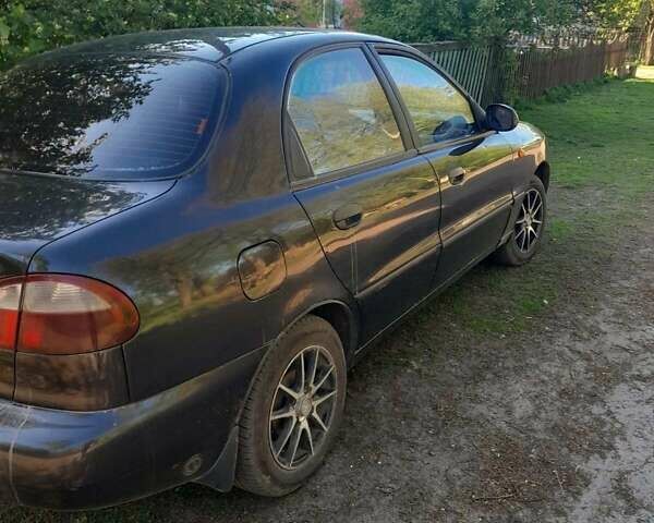 Черный Дэу Ланос, объемом двигателя 1.5 л и пробегом 180 тыс. км за 2250 $, фото 4 на Automoto.ua