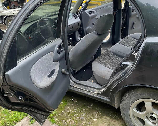 Черный Дэу Ланос, объемом двигателя 0 л и пробегом 250 тыс. км за 2000 $, фото 11 на Automoto.ua