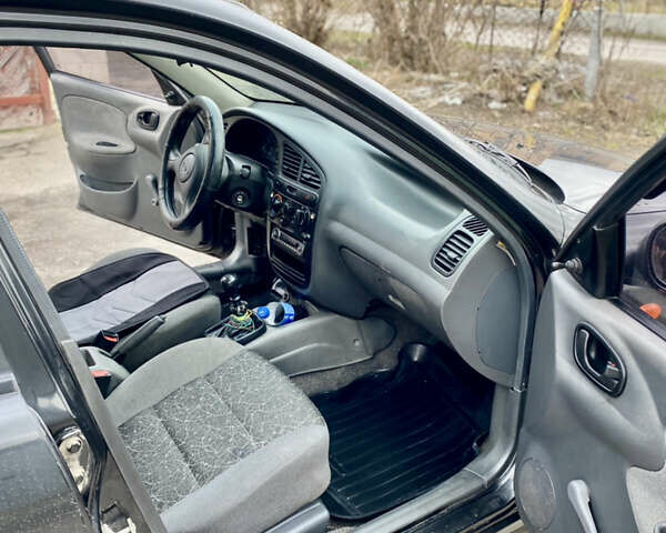 Чорний Деу Ланос, об'ємом двигуна 1.4 л та пробігом 180 тис. км за 1800 $, фото 19 на Automoto.ua