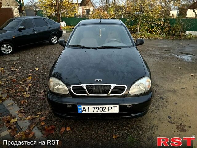 Черный Дэу Ланос, объемом двигателя 1.4 л и пробегом 220 тыс. км за 1800 $, фото 1 на Automoto.ua