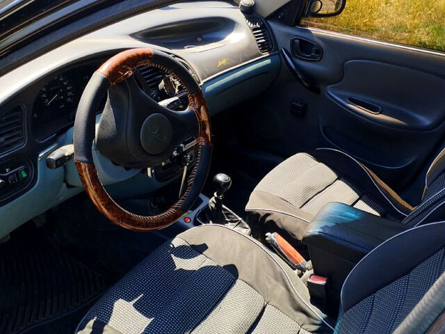 Черный Дэу Ланос, объемом двигателя 1.5 л и пробегом 240 тыс. км за 3300 $, фото 2 на Automoto.ua