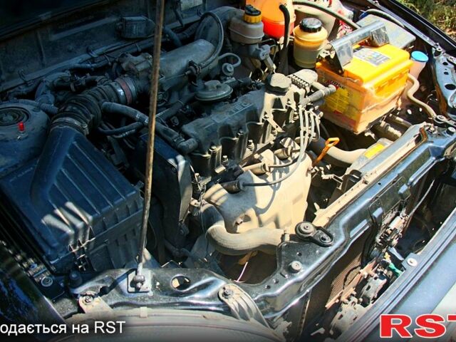 Черный Дэу Ланос, объемом двигателя 1.6 л и пробегом 104 тыс. км за 3000 $, фото 2 на Automoto.ua