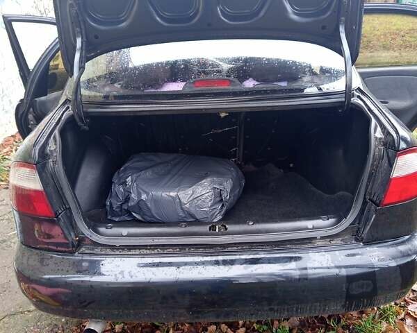 Черный Дэу Ланос, объемом двигателя 1.5 л и пробегом 180 тыс. км за 2300 $, фото 1 на Automoto.ua