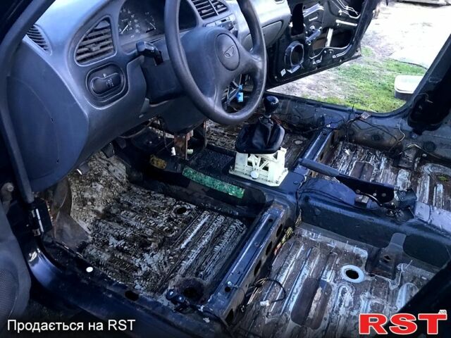 Черный Дэу Ланос, объемом двигателя 1.5 л и пробегом 368 тыс. км за 1150 $, фото 6 на Automoto.ua