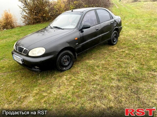 Чорний Деу Ланос, об'ємом двигуна 1.5 л та пробігом 256 тис. км за 1100 $, фото 1 на Automoto.ua