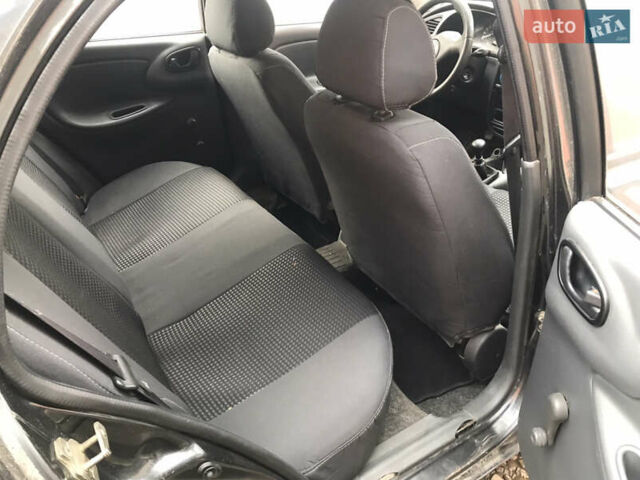 Черный Дэу Ланос, объемом двигателя 1.5 л и пробегом 150 тыс. км за 950 $, фото 5 на Automoto.ua