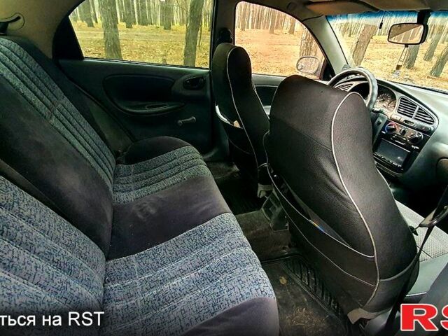 Черный Дэу Ланос, объемом двигателя 1.4 л и пробегом 234 тыс. км за 1600 $, фото 10 на Automoto.ua