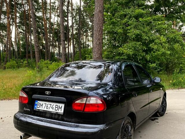 Черный Дэу Ланос, объемом двигателя 1.4 л и пробегом 245 тыс. км за 1700 $, фото 1 на Automoto.ua