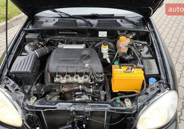 Черный Дэу Ланос, объемом двигателя 1.39 л и пробегом 213 тыс. км за 2300 $, фото 4 на Automoto.ua