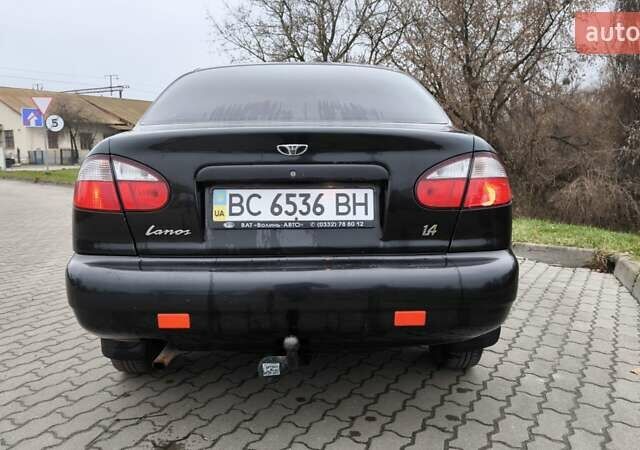 Черный Дэу Ланос, объемом двигателя 1.39 л и пробегом 213 тыс. км за 2300 $, фото 2 на Automoto.ua