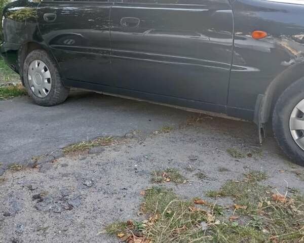 Чорний Деу Ланос, об'ємом двигуна 1.5 л та пробігом 260 тис. км за 2600 $, фото 3 на Automoto.ua