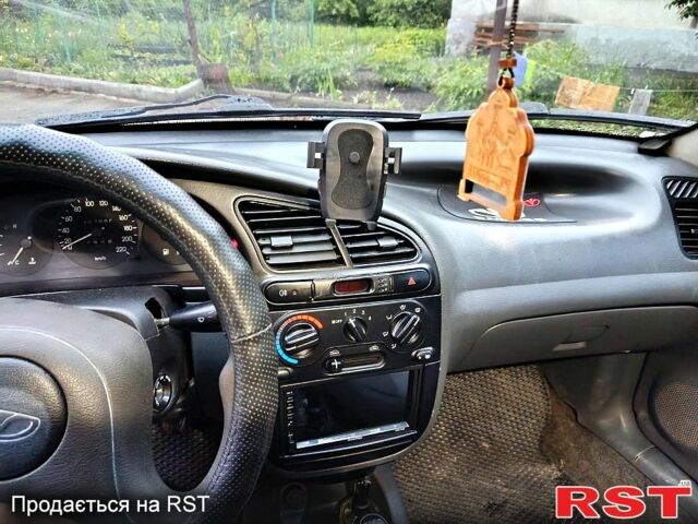 Черный Дэу Ланос, объемом двигателя 1.5 л и пробегом 240 тыс. км за 1650 $, фото 2 на Automoto.ua