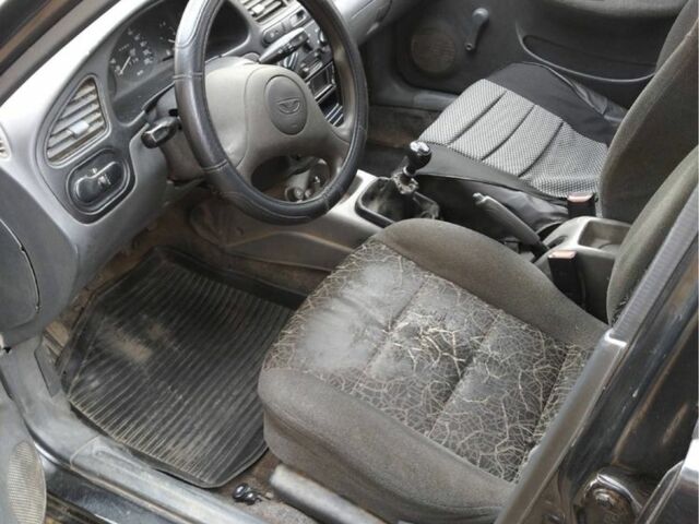 Черный Дэу Ланос, объемом двигателя 1.4 л и пробегом 1 тыс. км за 2000 $, фото 4 на Automoto.ua