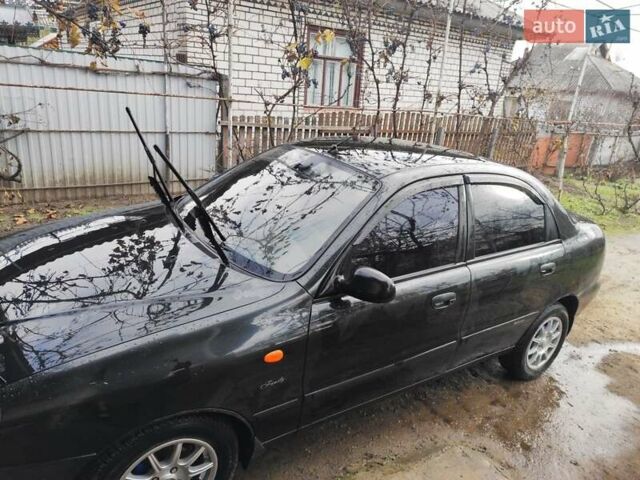 Черный Дэу Ланос, объемом двигателя 1.5 л и пробегом 130 тыс. км за 2700 $, фото 1 на Automoto.ua