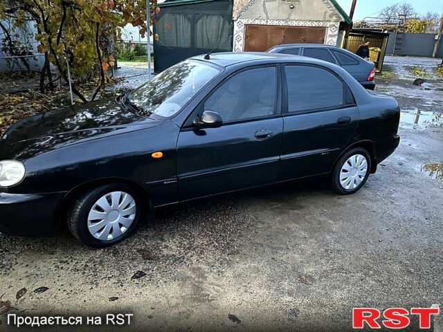 Черный Дэу Ланос, объемом двигателя 1.4 л и пробегом 220 тыс. км за 1800 $, фото 3 на Automoto.ua