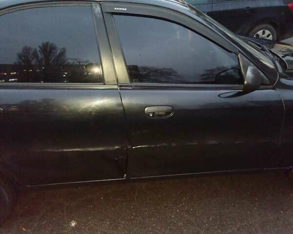 Чорний Деу Ланос, об'ємом двигуна 1.5 л та пробігом 114 тис. км за 2200 $, фото 4 на Automoto.ua