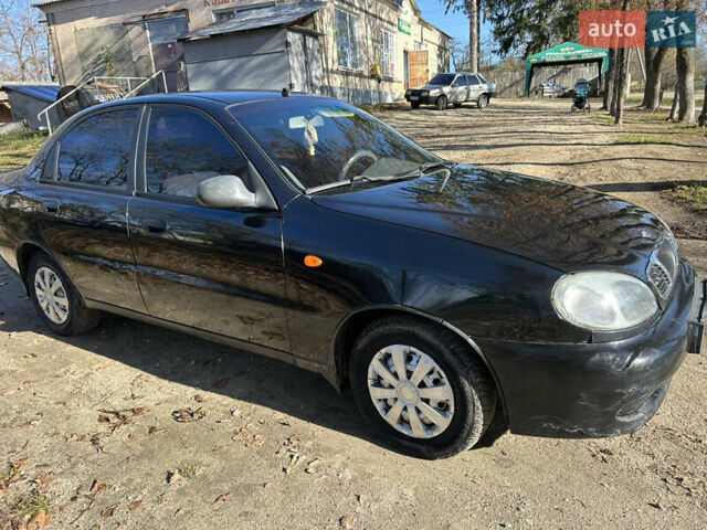 Черный Дэу Ланос, объемом двигателя 1.5 л и пробегом 152 тыс. км за 1550 $, фото 1 на Automoto.ua
