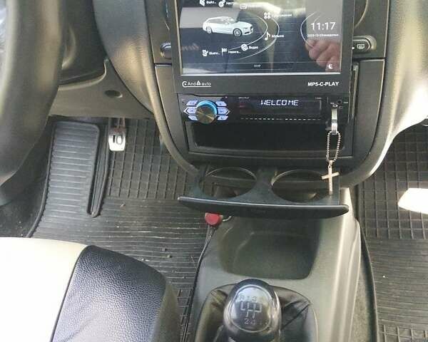 Черный Дэу Ланос, объемом двигателя 1.5 л и пробегом 350 тыс. км за 2500 $, фото 1 на Automoto.ua