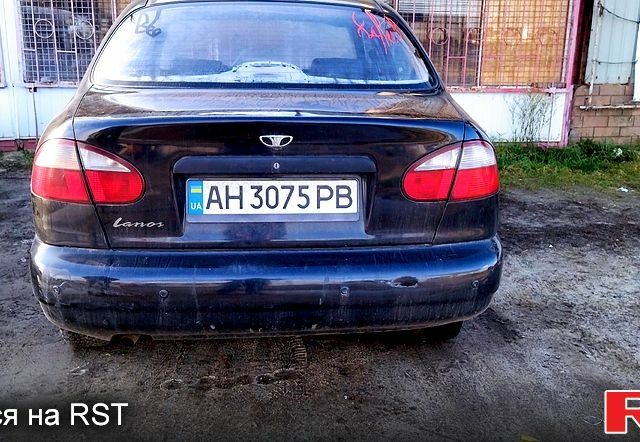 Черный Дэу Ланос, объемом двигателя 1.6 л и пробегом 269 тыс. км за 1300 $, фото 1 на Automoto.ua