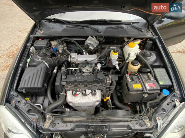 Черный Дэу Ланос, объемом двигателя 1.5 л и пробегом 231 тыс. км за 2900 $, фото 14 на Automoto.ua