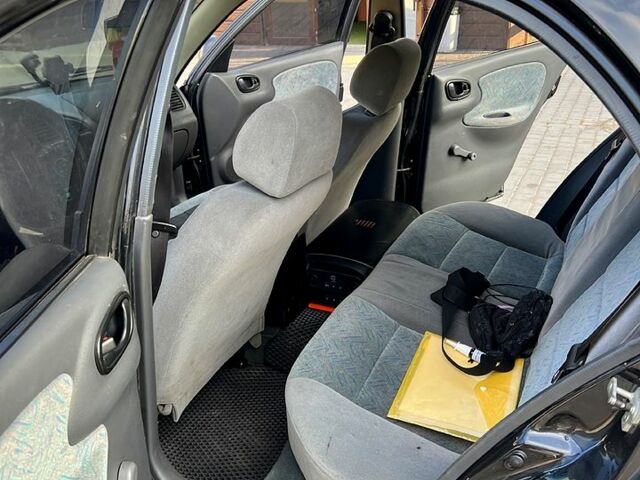 Черный Дэу Ланос, объемом двигателя 1.4 л и пробегом 0 тыс. км за 2300 $, фото 2 на Automoto.ua