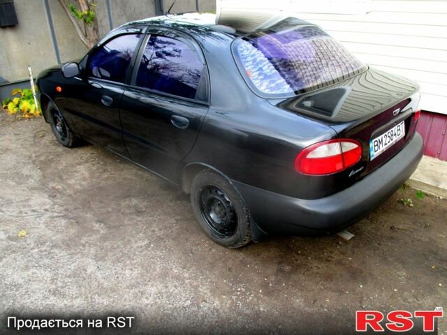 Черный Дэу Ланос, объемом двигателя 1.5 л и пробегом 230 тыс. км за 2000 $, фото 3 на Automoto.ua
