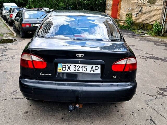 Черный Дэу Ланос, объемом двигателя 1.4 л и пробегом 200 тыс. км за 1950 $, фото 1 на Automoto.ua