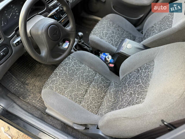Черный Дэу Ланос, объемом двигателя 1.5 л и пробегом 100 тыс. км за 2900 $, фото 14 на Automoto.ua