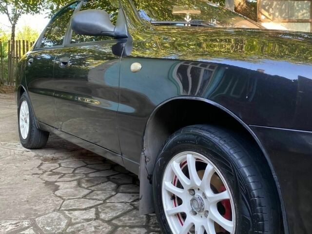 Черный Дэу Ланос, объемом двигателя 1.5 л и пробегом 1000 тыс. км за 2600 $, фото 2 на Automoto.ua