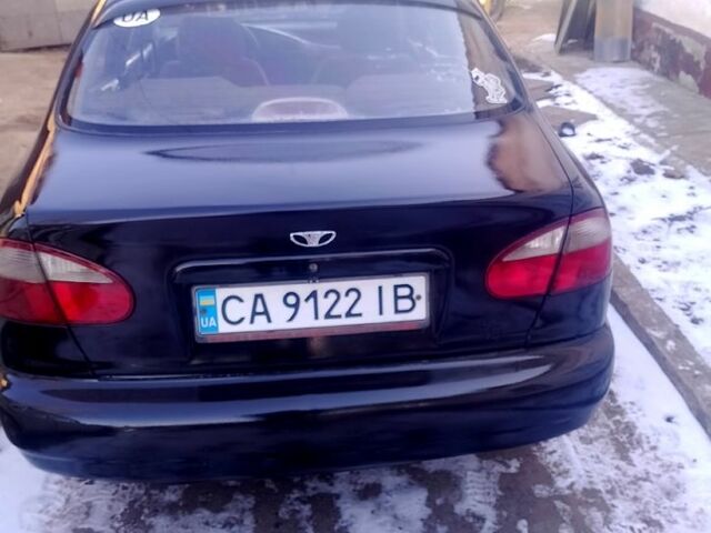 Черный Дэу Ланос, объемом двигателя 1.4 л и пробегом 255 тыс. км за 2000 $, фото 3 на Automoto.ua