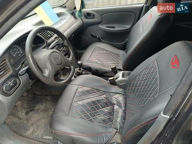 Черный Дэу Ланос, объемом двигателя 1.5 л и пробегом 200 тыс. км за 2100 $, фото 6 на Automoto.ua