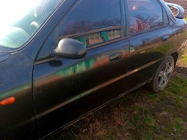 Черный Дэу Ланос, объемом двигателя 1.5 л и пробегом 286 тыс. км за 1000 $, фото 6 на Automoto.ua