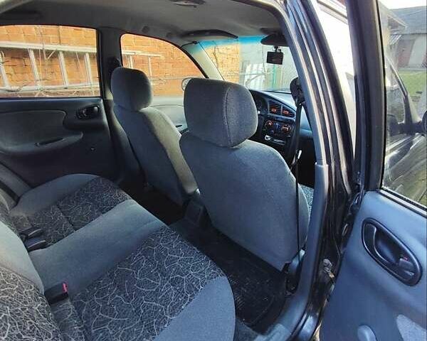 Черный Дэу Ланос, объемом двигателя 1.4 л и пробегом 165 тыс. км за 1450 $, фото 9 на Automoto.ua