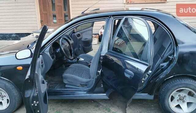 Черный Дэу Ланос, объемом двигателя 1.3 л и пробегом 160 тыс. км за 2000 $, фото 1 на Automoto.ua