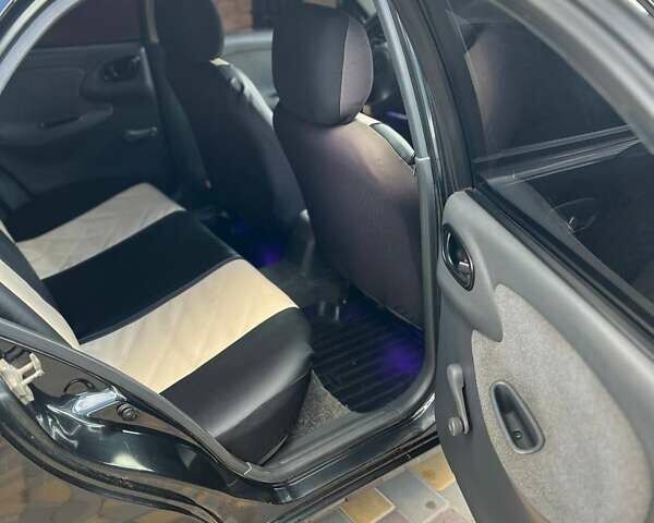 Чорний Деу Ланос, об'ємом двигуна 1.5 л та пробігом 152 тис. км за 2550 $, фото 10 на Automoto.ua