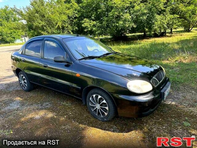 Черный Дэу Ланос, объемом двигателя 1.4 л и пробегом 250 тыс. км за 1999 $, фото 6 на Automoto.ua