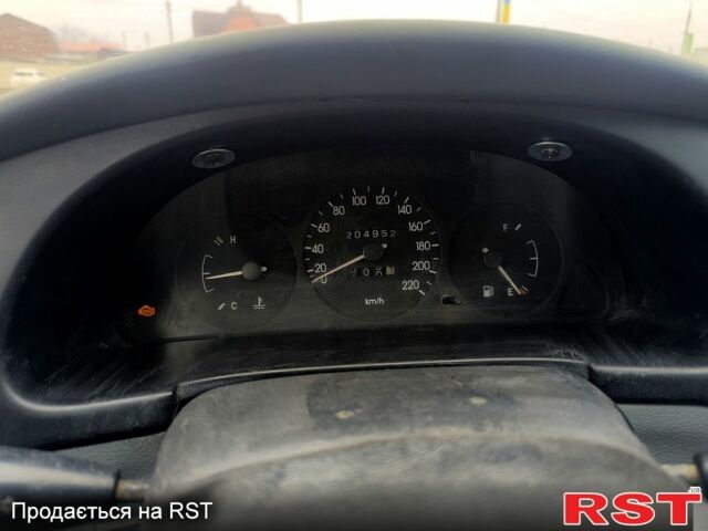 Черный Дэу Ланос, объемом двигателя 1.5 л и пробегом 220 тыс. км за 1000 $, фото 5 на Automoto.ua