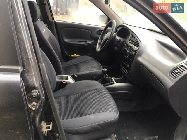 Черный Дэу Ланос, объемом двигателя 1.5 л и пробегом 150 тыс. км за 950 $, фото 6 на Automoto.ua