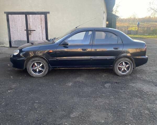Черный Дэу Ланос, объемом двигателя 1.5 л и пробегом 204 тыс. км за 2350 $, фото 1 на Automoto.ua