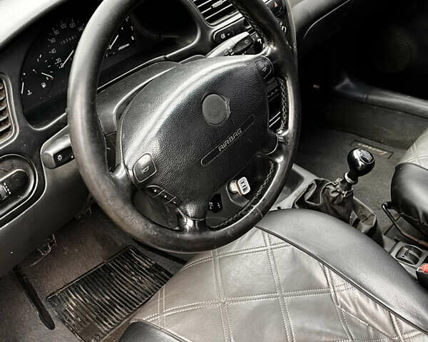 Черный Дэу Ланос, объемом двигателя 1.5 л и пробегом 200 тыс. км за 2000 $, фото 6 на Automoto.ua