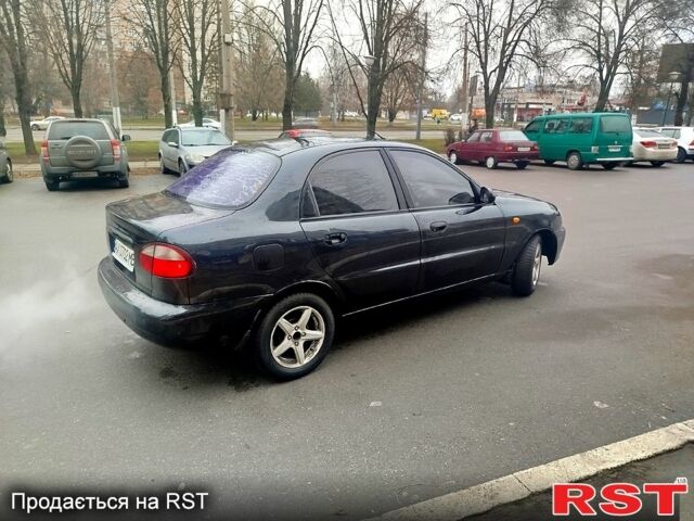 Черный Дэу Ланос, объемом двигателя 1.6 л и пробегом 200 тыс. км за 2100 $, фото 2 на Automoto.ua