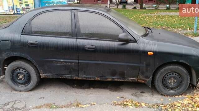 Чорний Деу Ланос, об'ємом двигуна 1.5 л та пробігом 220 тис. км за 800 $, фото 1 на Automoto.ua