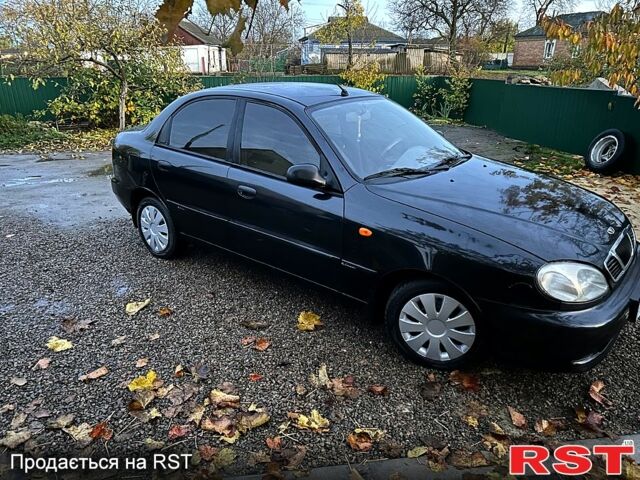 Черный Дэу Ланос, объемом двигателя 1.4 л и пробегом 220 тыс. км за 1800 $, фото 2 на Automoto.ua