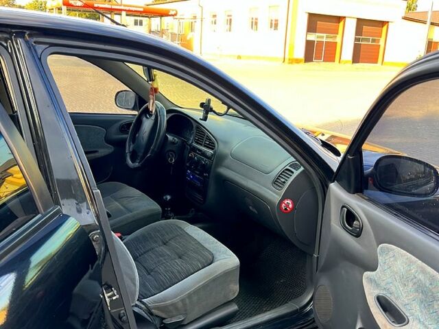 Черный Дэу Ланос, объемом двигателя 1.4 л и пробегом 0 тыс. км за 2300 $, фото 4 на Automoto.ua