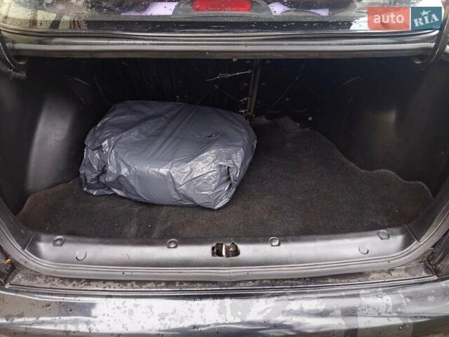 Черный Дэу Ланос, объемом двигателя 1.5 л и пробегом 180 тыс. км за 2300 $, фото 2 на Automoto.ua