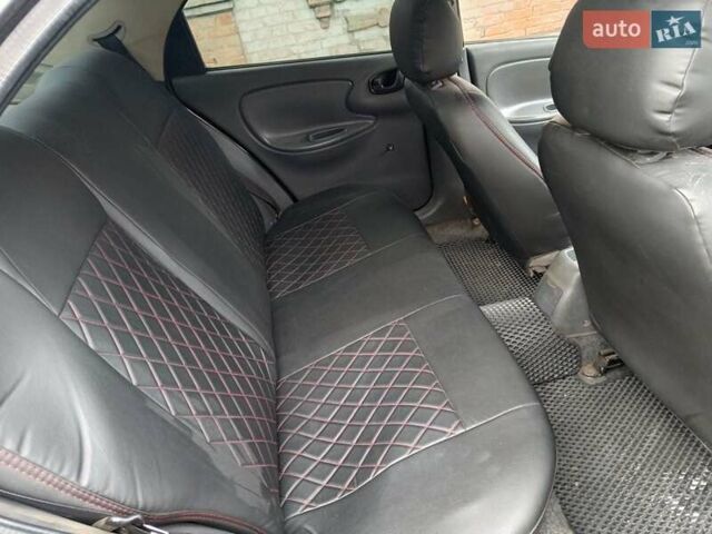 Черный Дэу Ланос, объемом двигателя 1.5 л и пробегом 200 тыс. км за 2100 $, фото 7 на Automoto.ua